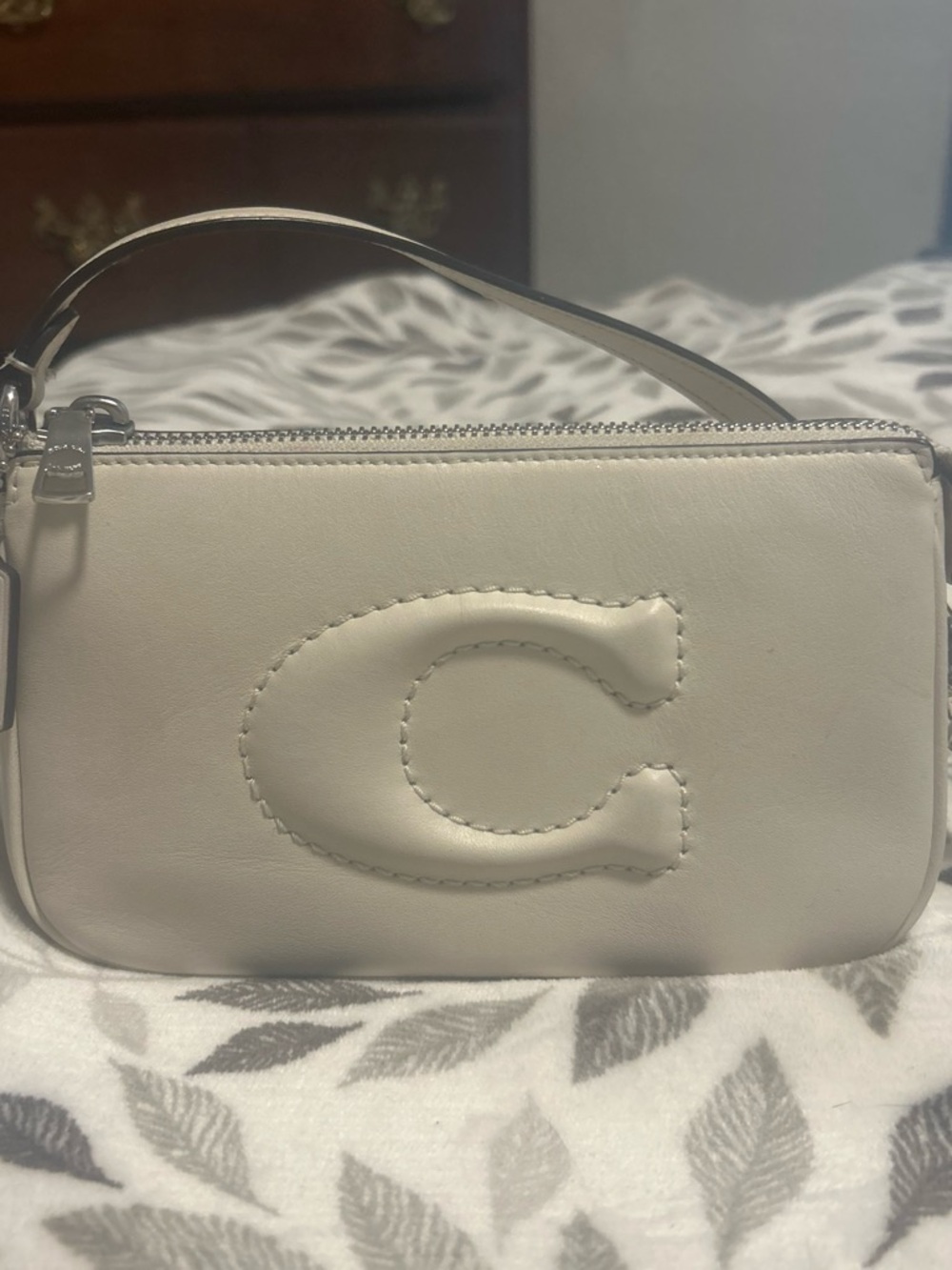 Coach Ivory Leather Wristlet with Embossed 'C'